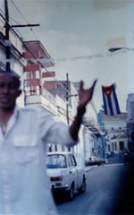 La Matanzas (Man waving, Cuban flag background)